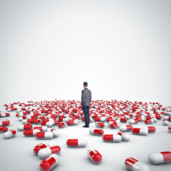 a person surrounded by pills